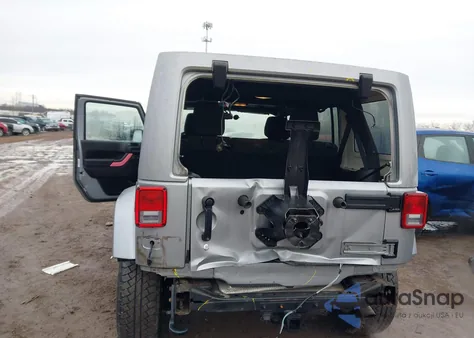 2013 Jeep Wrangler Unlimited Sahara z USA, uszkodzony, nr VIN 1C4BJWEG3DL627424